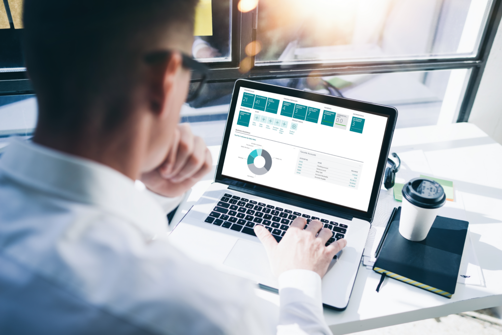 Employee using business central dashboard to track financial performance